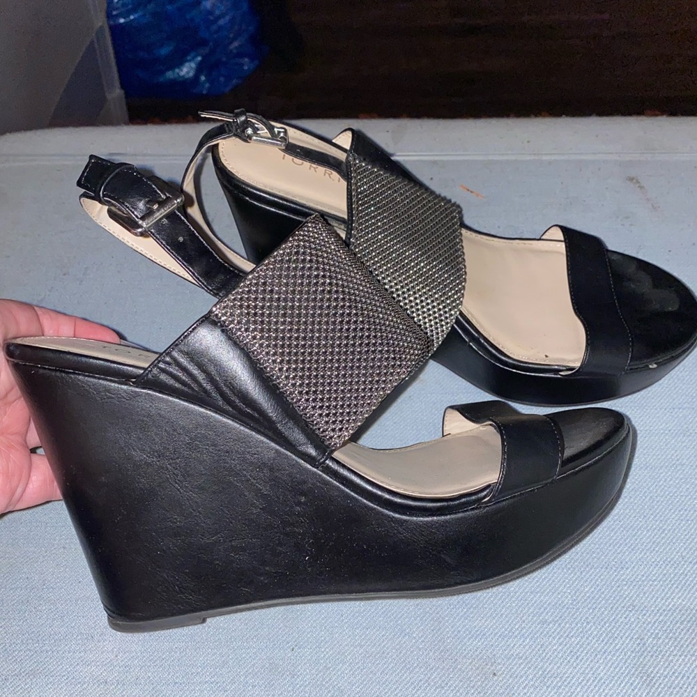 Black wedges with thick silver strap accent
